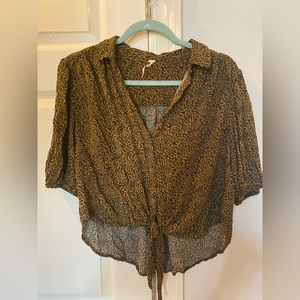 Free People top. Cheetah print brown black and orange. Button up with tie bottom